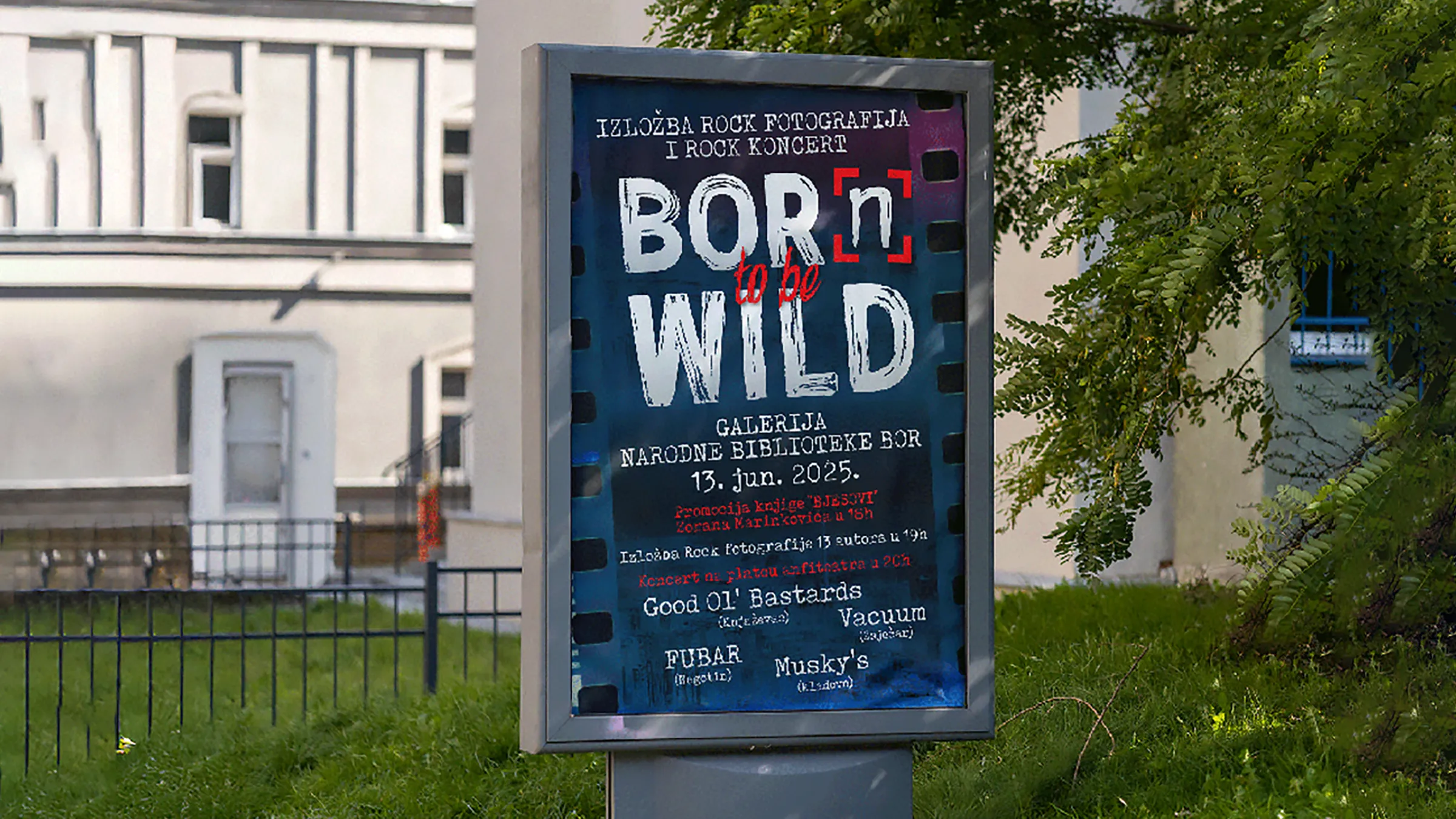 Plakat u gradskom svetlosnom panou, sa celim programom: promocija knjige, otvaranje izložbe i spisak bendova